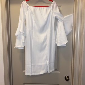 white dress and the sleeves are stunning.